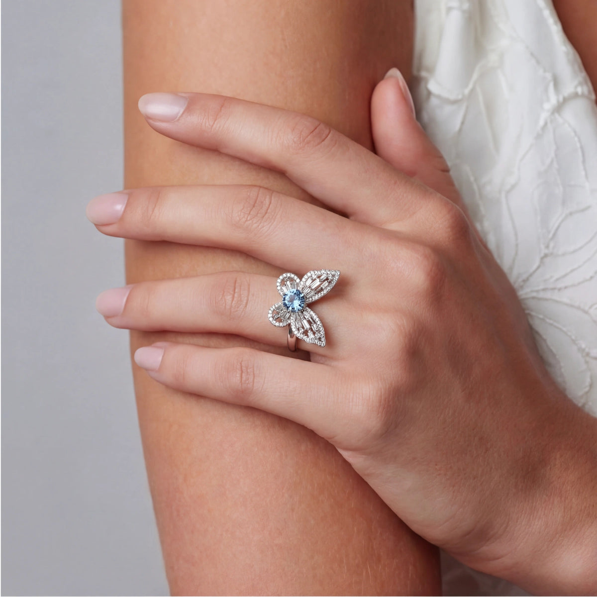 Beautiful Blue Butterfly Moissanite Ring featuring a blue center stone and intricate sterling silver design.