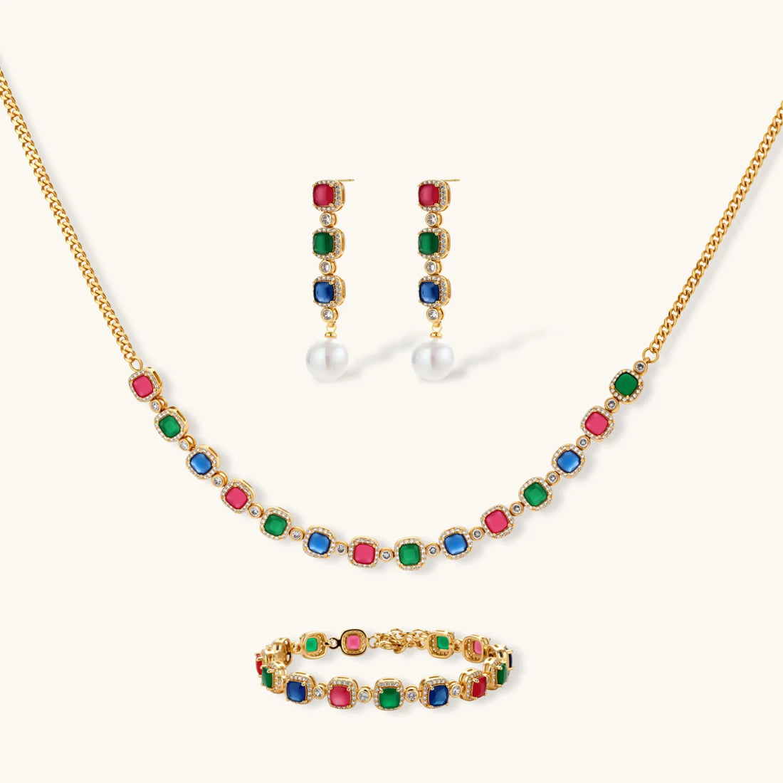 Gold-plated jewelry set with red, green, and blue cubic zirconia stones including necklace, bracelet, and drop earrings.