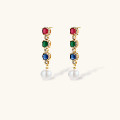 Gold-plated jewelry set with red, green, and blue cubic zirconia stones including necklace, bracelet, and drop earrings.