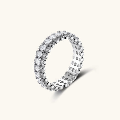 Sterling silver eternity ring with continuous row of brilliant moissanite stones in scalloped crown setting with milgrain detail