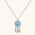 Sterling silver dreamcatcher pendant with blue moissanite center and three feather charms on adjustable chain.