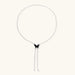 Wooden butterfly pendant necklace with cascading silver-toned chains on adjustable chain, available in amber and black.
