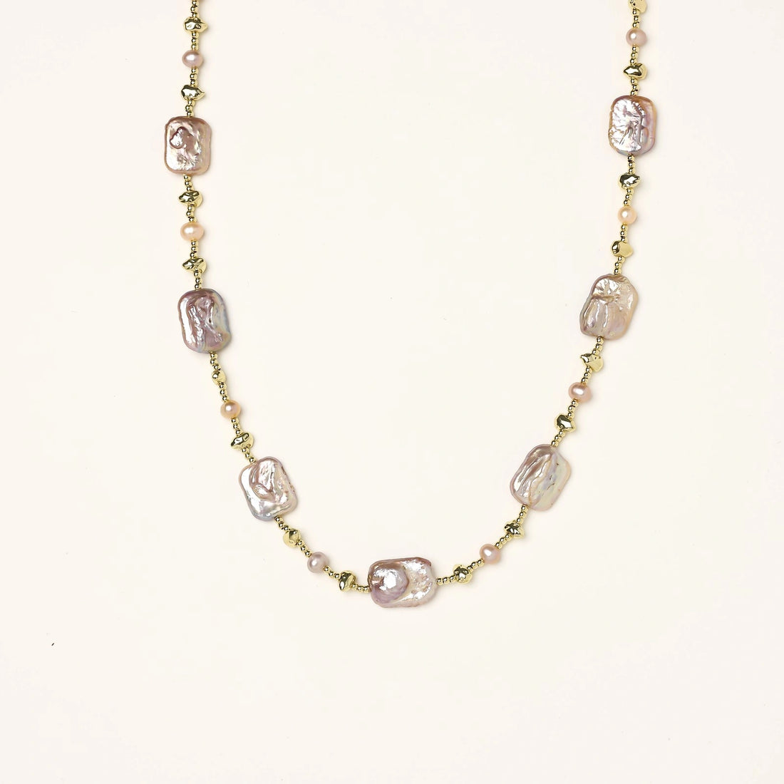 Iridescent baroque pearls alternating with small freshwater pearls on 14K gold-plated chain