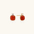 18K gold vermeil stud earrings with cushion-cut red agate stones and sparkling crystal accents on beige background