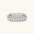 Sterling silver eternity ring with continuous row of brilliant moissanite stones in scalloped crown setting with milgrain detail