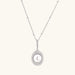 Oval sterling silver pendant with crystal halo surrounding a white freshwater pearl on delicate chain