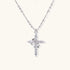 White gold-plated cross pendant adorned with sparkling zirconia stones and crescent moon accent on ball chain