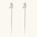 Silver-toned threader earrings featuring detailed fairy figure with wings and dual delicate chain strands, zirconia accents