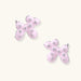 Glossy pink enamel balloon dog stud earrings with crystal details on white gold plated brass, museum-inspired design
