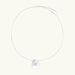 Sterling silver disc necklace with textured finish and centered freshwater pearl on delicate chain