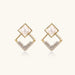 Gold-plated double square frame earrings with freshwater pearl and crystal accents on white background