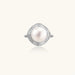 Rhodium-plated silver ring with round pearl center, double halo of baguette and round crystals forming cushion shape