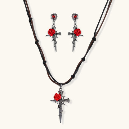 Gothic jewelry set with dark metal thorny cross pendants featuring red enamel roses and matching red crystal earrings